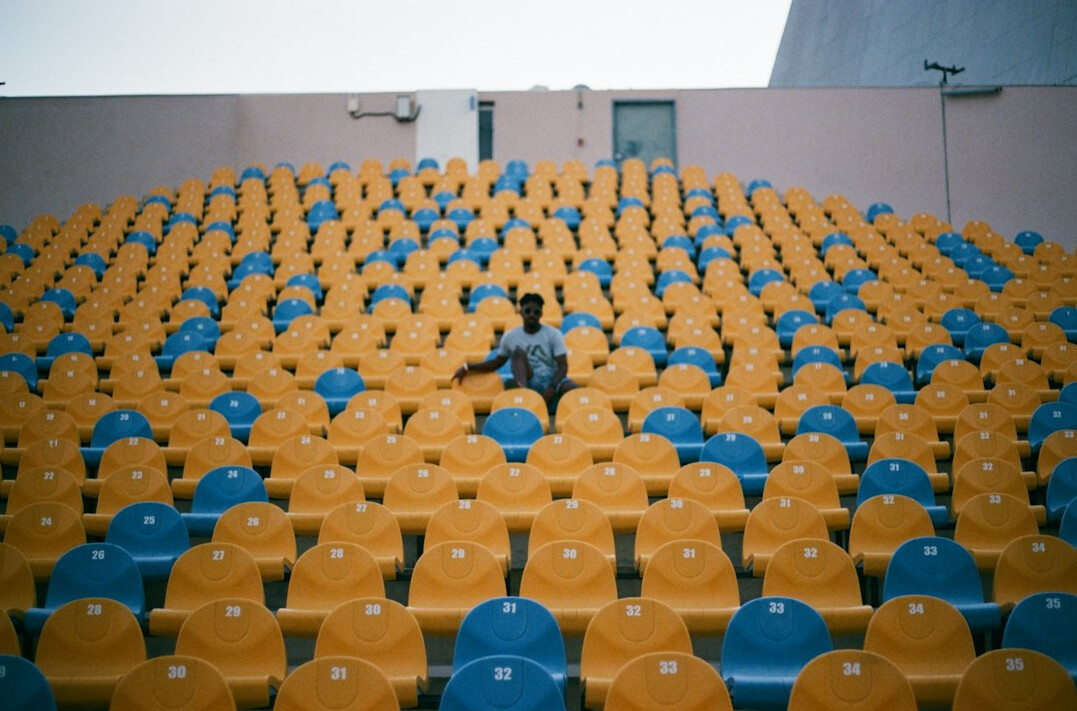 Empty theatre auditorium with rows of vacant seats