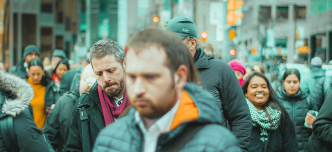 person standing alone in crowd